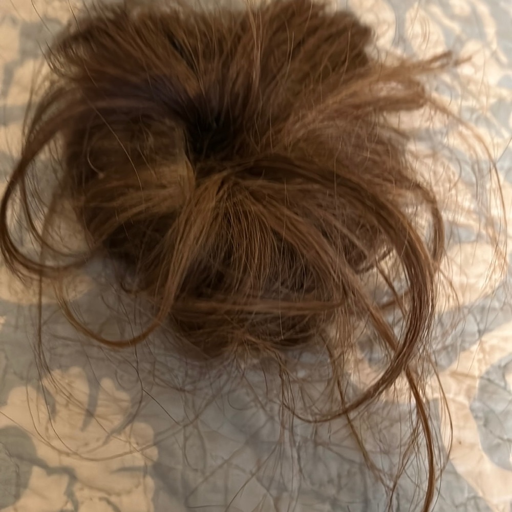 Faux hair bun.